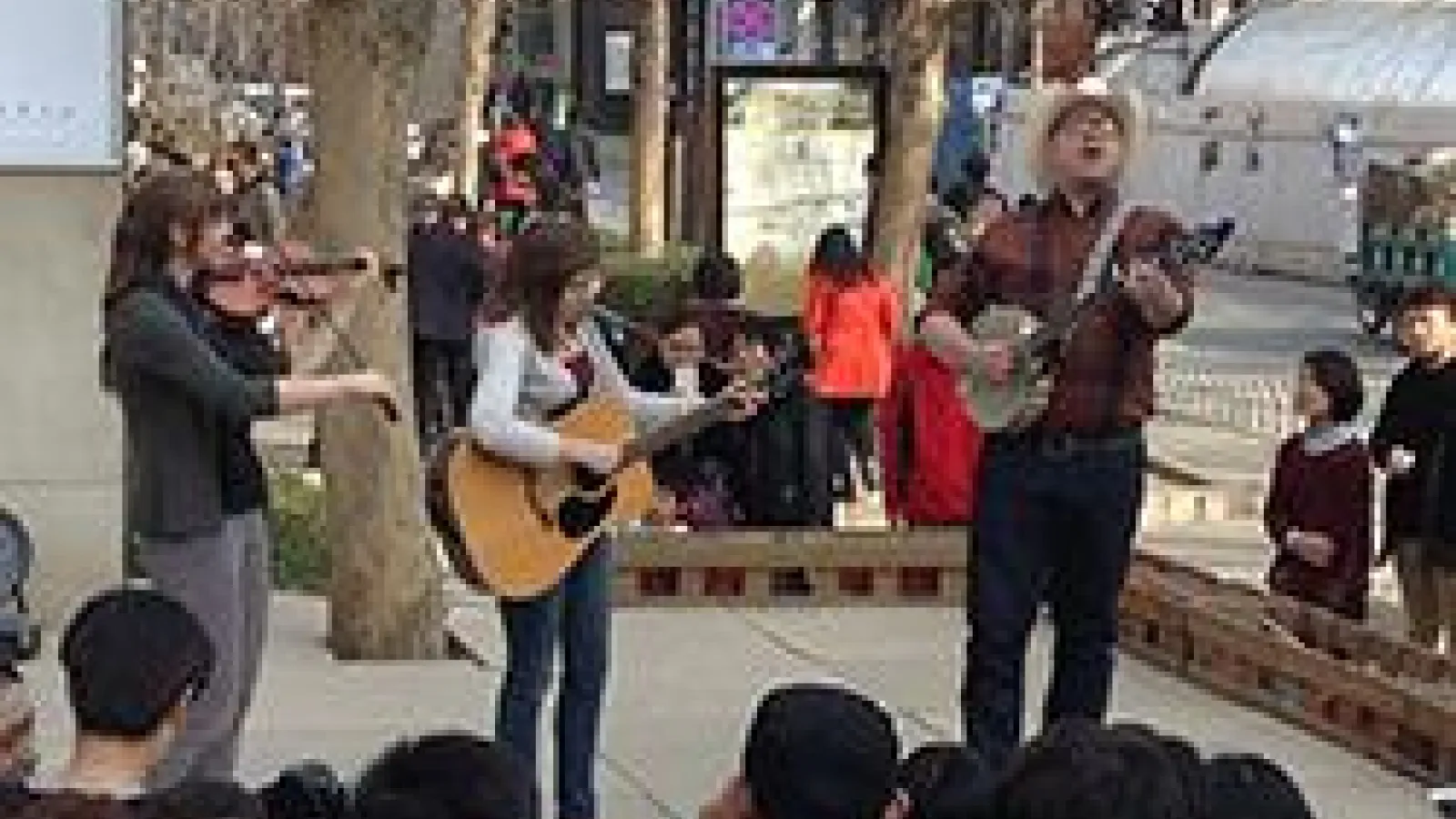 Trio performing in China square