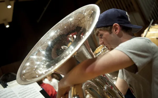 Male student playing a tuba